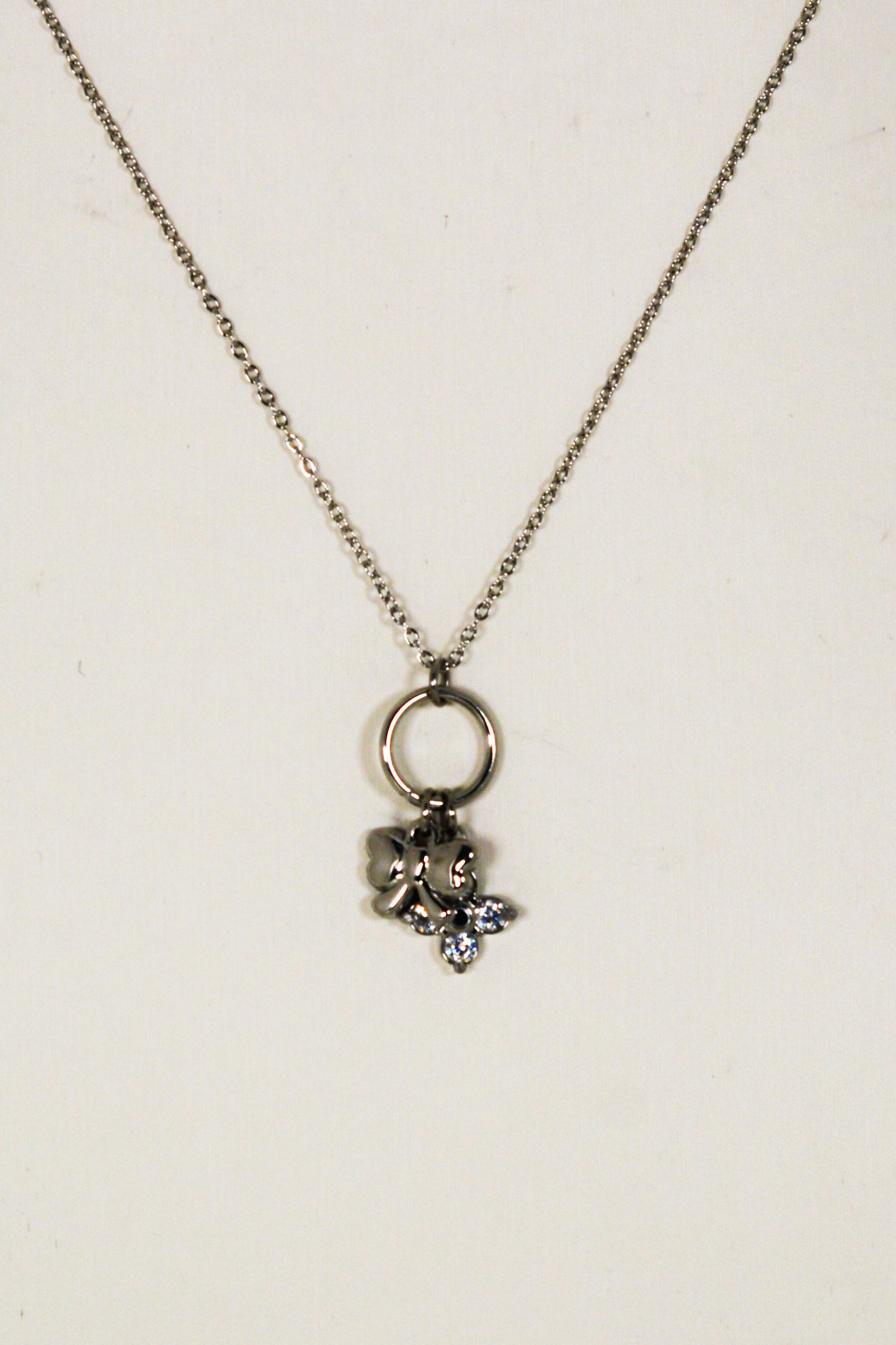collana fiocco e quadrifoglio
